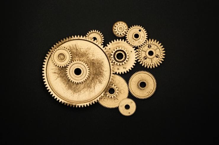 a set of gears denoting a system of momentum